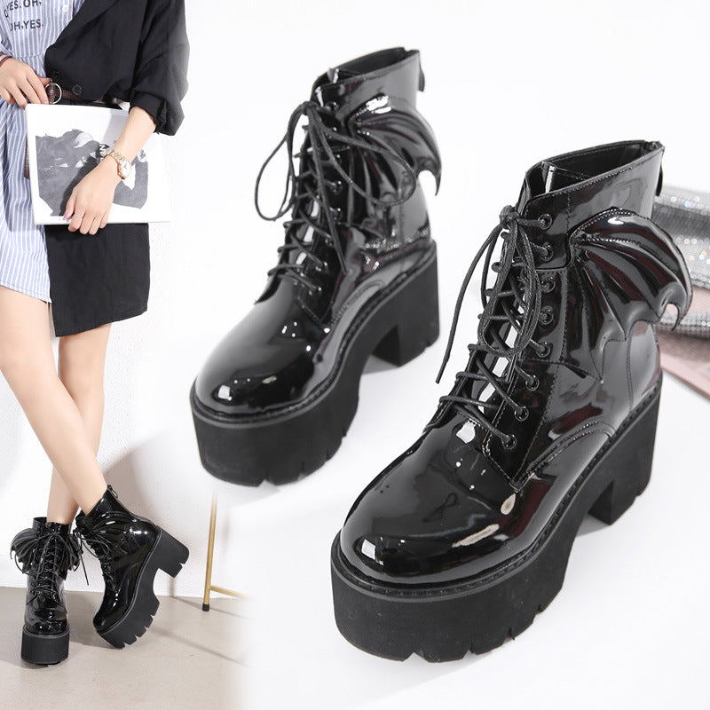 Women's black patent leather gothic boots styled with alternative darkwear fashion outfit