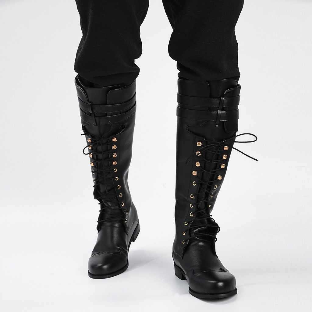Close-up of rivet and hollow detail on men's gothic knight pirate boots in faux leather, flat rubber sole