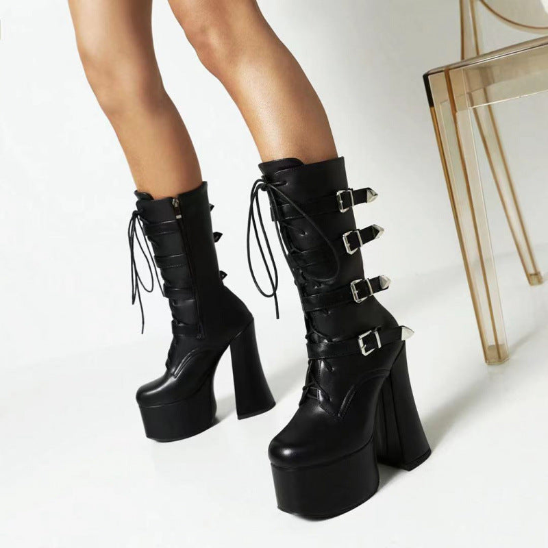 Women's black patent leather platform Martin boots with super high shaped heel and rivet buckle detail, gothic dark feminine