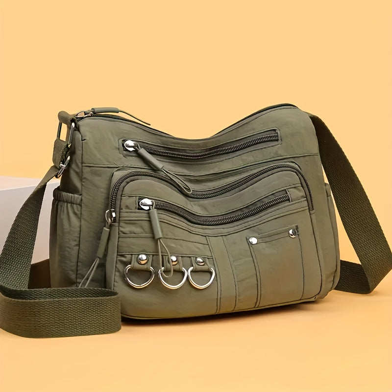 Multi-pocket hobo crossbody bag in green from Alternative Darkwear