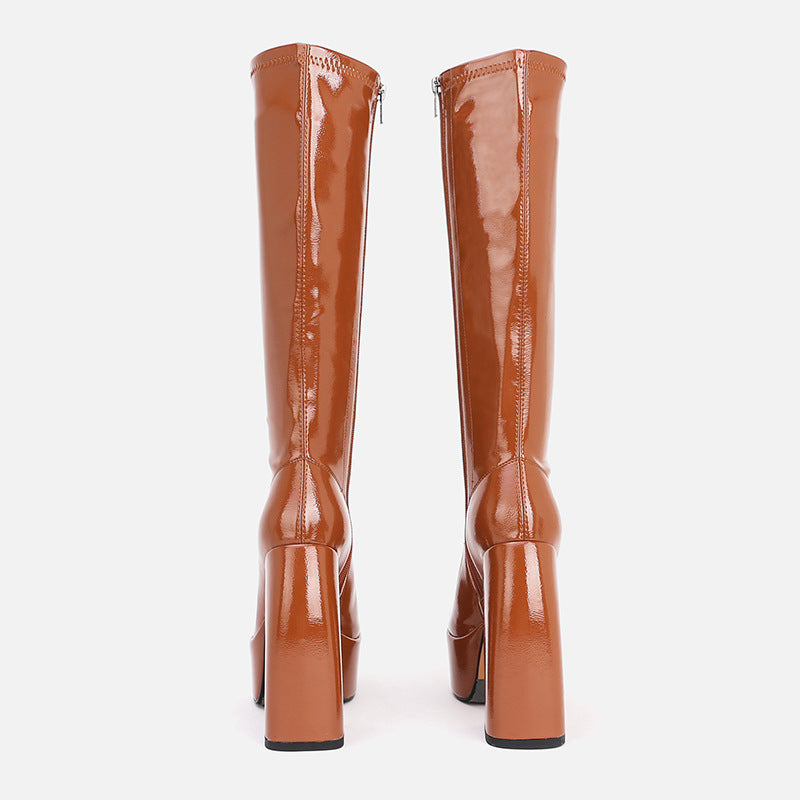 Side view of women's above-knee platform boots with chunky heel and fringe detail, alternative darkwear style