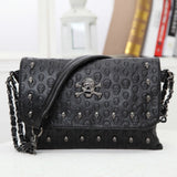 Black gothic skull emboss crossbody bag women detail view rivet studs chain strap flap PU Alternative Darkwear