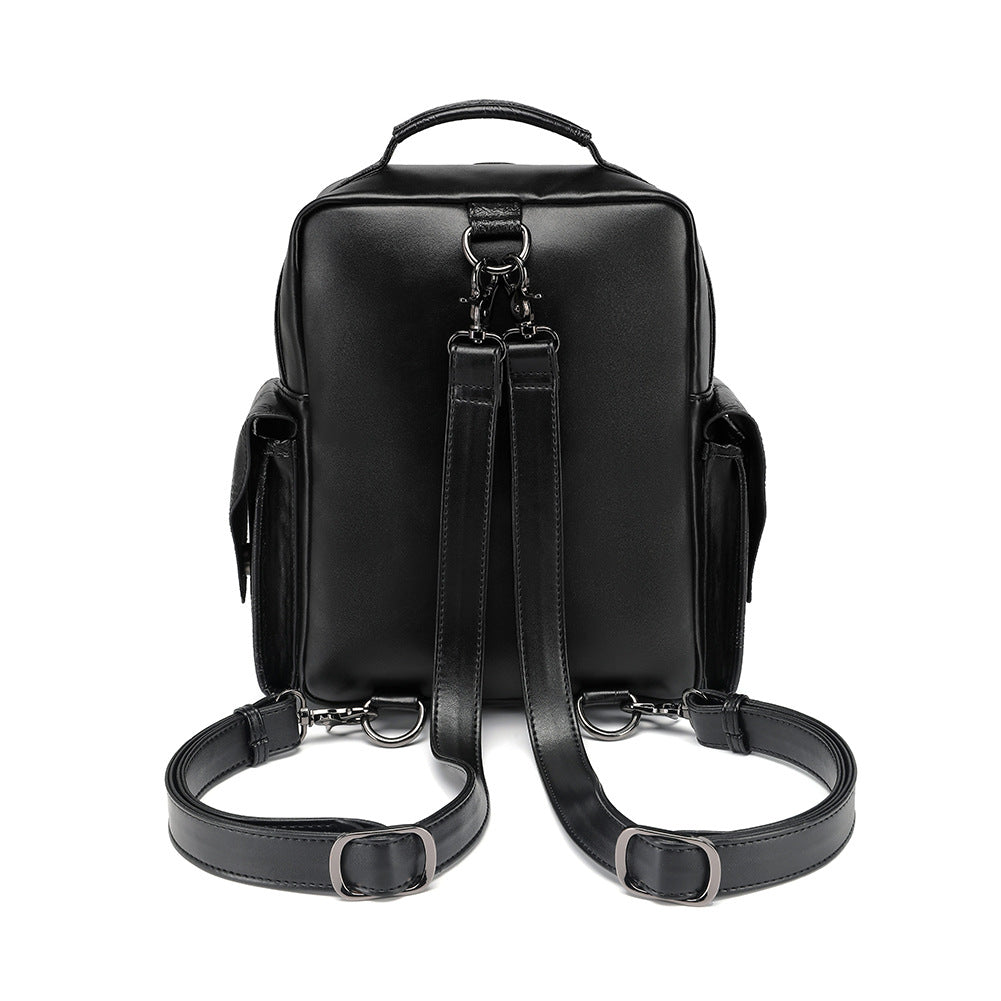 Black gothic skull rose embroidered backpack women side view PU crinkle stud eyelet trim Alternative Darkwear