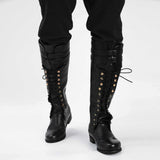 Close-up of rivet and hollow detail on men's gothic knight pirate boots in faux leather, flat rubber sole