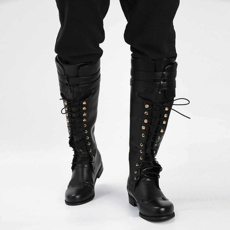 Close-up of rivet and hollow detail on men's gothic knight pirate boots in faux leather, flat rubber sole