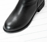 Close-up of round toe on women's black genuine leather over-the-knee winter boot, darkwear fashion, Alternative Darkwear