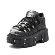 Front view of women's platform tank boots with bold chunky sole and lace-up closure, darkwear 