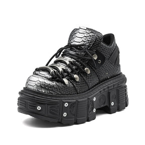 Front view of women's platform tank boots with bold chunky sole and lace-up closure, darkwear 