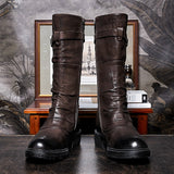 Pair of men's brown darkwear biker boots displayed front-facing showing buckle straps and side zippers, Alternative Darkwear
