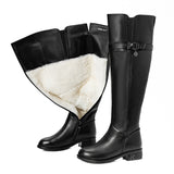 Women's black over-the-knee genuine leather winter boots with sheep fur lining and buckle strap detail, dark feminine fashion, Alternative Darkwear