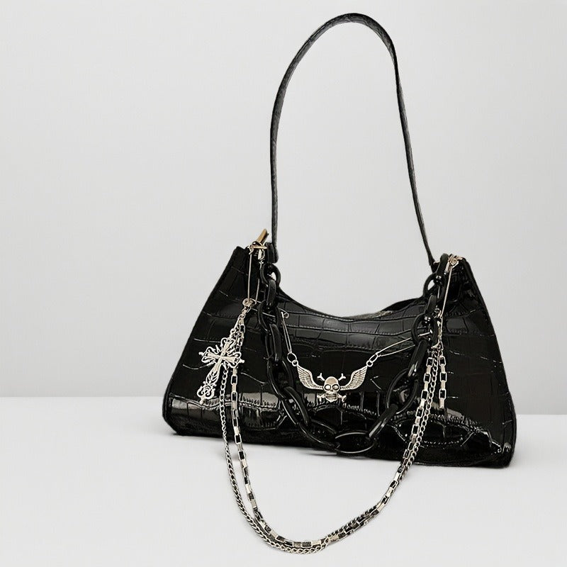 Detail view of gothic chain strap and hardware on black alligator faux leather shoulder bag from Alternative Darkwear