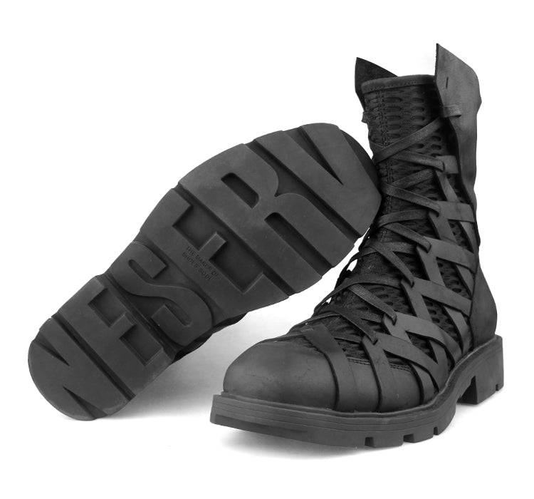 Close-up of crazy horse leather texture on men's gothic square toe boots with block heel