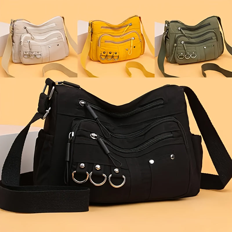 Multi-pocket hobo crossbody bag showing all four colorways — black, green, yellow and beige — from Alternative Darkwear